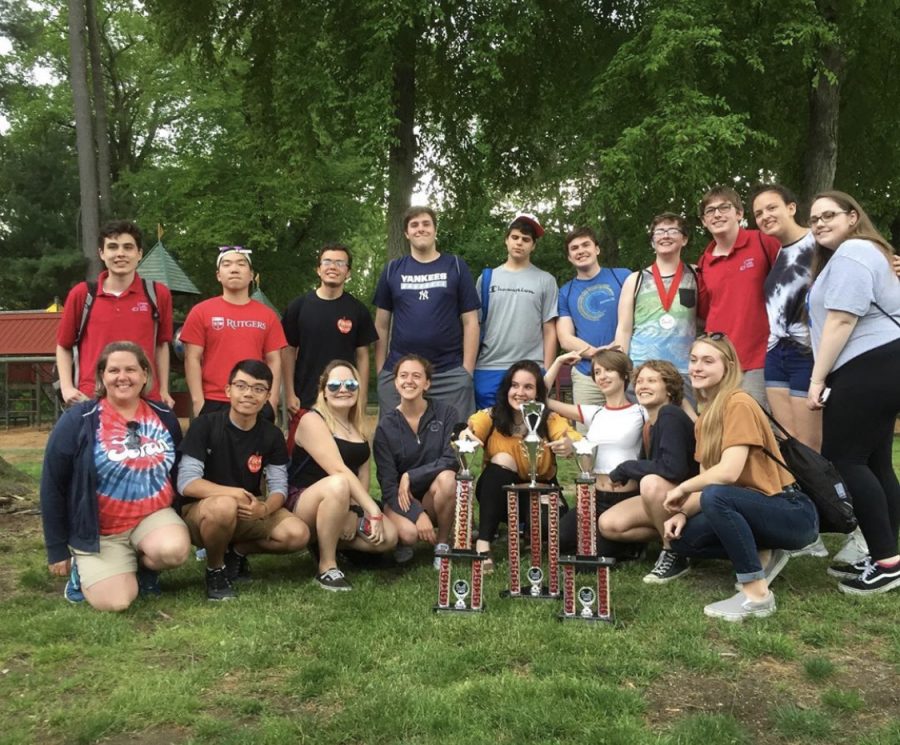 The senior members of Foran’s band pose with their director, Ms. Jessica Turner, displaying their awards won at Music in the Parks. Photo courtesy of the Mane Street Mirror Instagram, @manestmirror1.