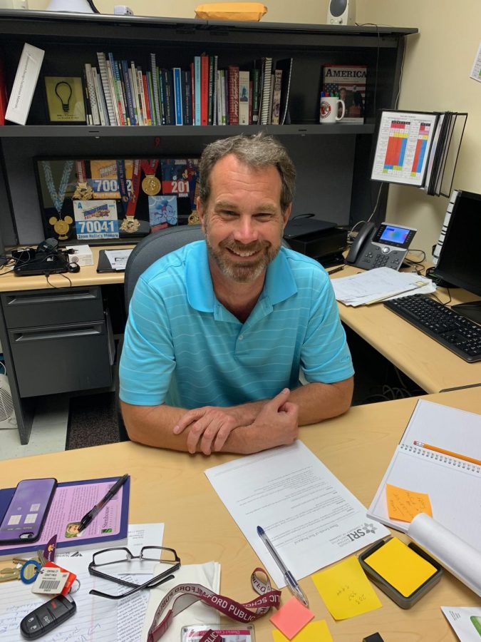  Mr. Brian Scott in his new office on August 13, 2019, excited to start the new school year. Photo taken by Carly Whelan.
