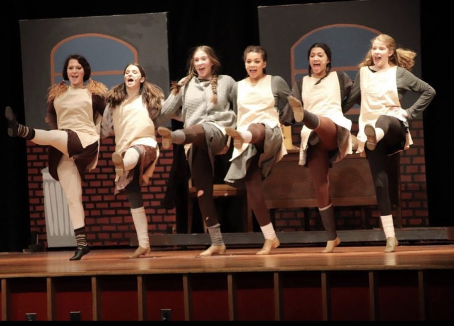 Senior Jenna King, center, performing as Duffy in Foran Drama Club’s production of Annie in 2019. Photo courtesy of Jenna King.