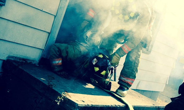 Milford firefighters battle on the scene. Photo courtesy of Milford firefighter Facebook. 
