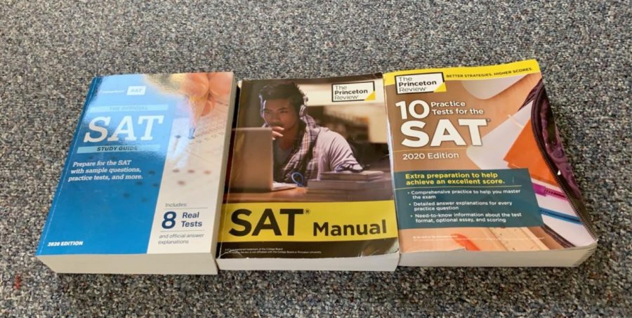 multiple textbooks Junior Shea Carroll has used to prepare for the SAT. Photo courtesy Shea Carroll
