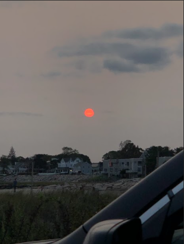 In the past few weeks, air quality all the way on the Eastern seaboard has been affected. In this picture from September 16 in Milford, Connecticut, the sun appears red as it sets because of the California smoke in the air. Photo courtesy of Emma Fiorillo.
