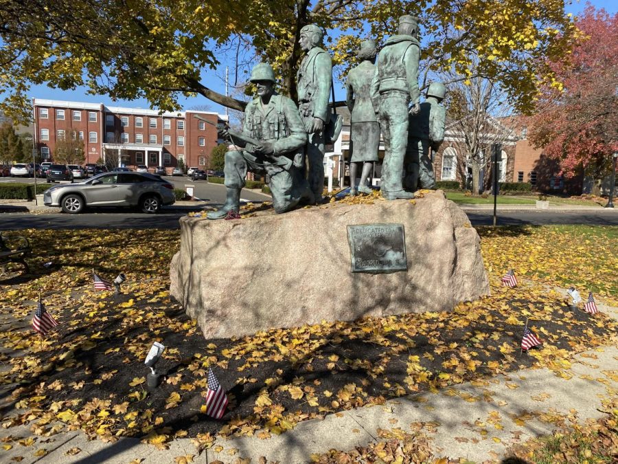 Caption: In Honor of Veterans : Veterans are remembered in Milford. Downtown there is a World War II monument at the Milford Green. Photo courtesy: Daniel Abate, November 9, 2020. 
