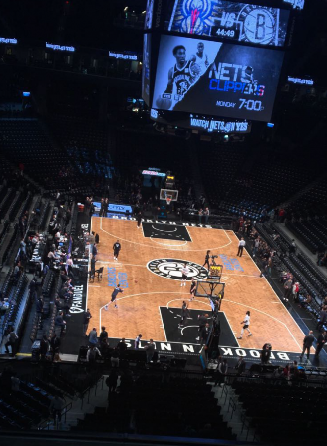  The Brooklyn Nets warm up on the basketball court before their game against the New Orleans Pelicans. Photo courtesy of Ian Eisenman, December 27, 2017.