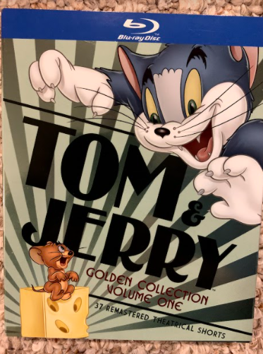 The Mischievous Mouse and the Tormented Tomcat: A hungry Tom the tomcat pursues a mocking Jerry the mouse on the cover of the Tom & Jerry Golden Collection Volume One Blu-ray Disc. Photo Courtesy: Connor Nieman, January 11, 2021.