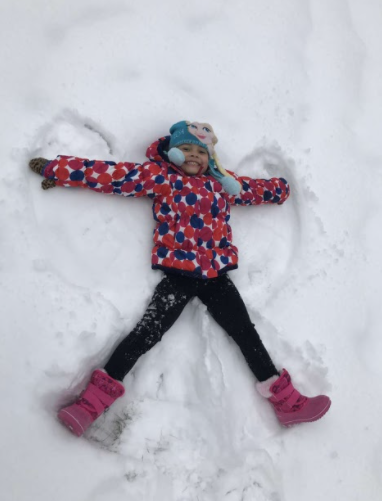 Making the Most of the Snow: Isabella Torres making snow angels. Photo courtesy: Bianca Torres. December 2016.