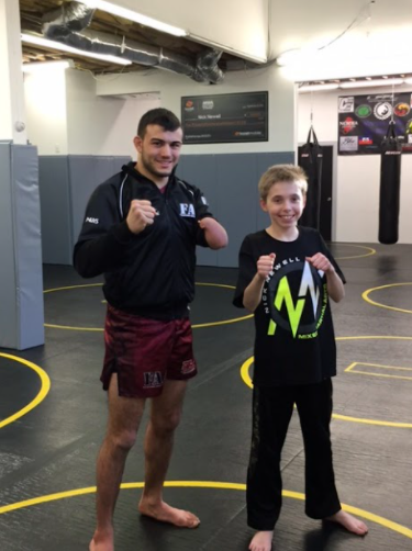 Ready to fight: Nick Newell and James Dalby posing for a picture at Fighting Arts Academy CT. Photo Courtesy: Karen Dalby, 2016