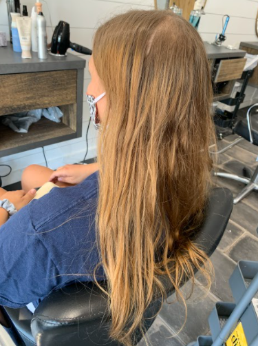 Pictured above is a before picture of Erin Coyle´s client Abby Woodward´s hair that has been dyed at home, not received a hair trim in over a year, uses TRESemme and other over the counter products with harmful chemicals. Photo Courtesy Erin Coyle 6/22/2020