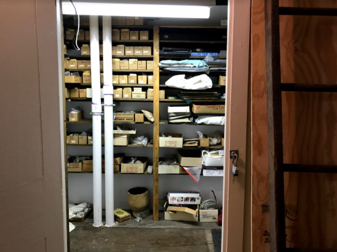 The storage closet in which a majority of the Claude C. Coffin collection is stored inside the Bryan-Downs house. Photo courtesy: Aidan Glass, May 8, 2021.