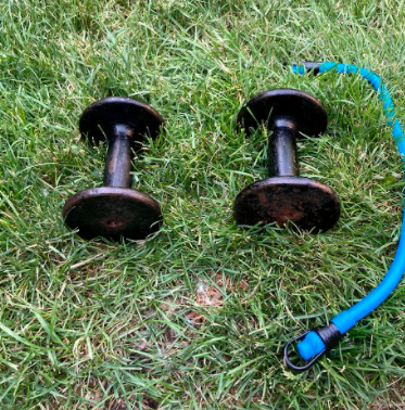 Dumbbells and elastic bands are a great way to stay fit. Photo Courtesy: James Dalby.  