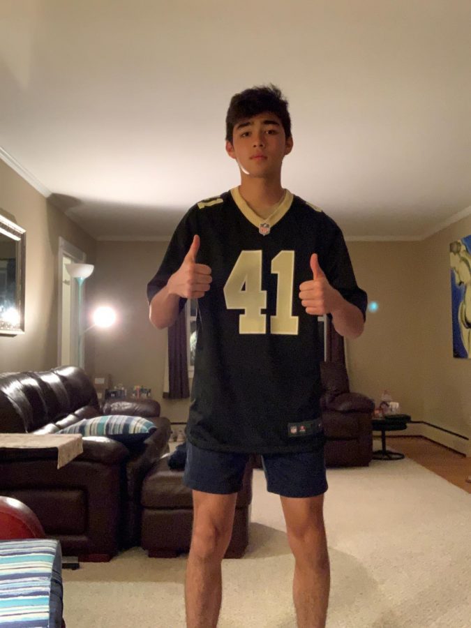 Game Day Ready: NFL football fan Joseph DeFreitas poses with his Alvin Kamara jersey in hopes for a Week One win.