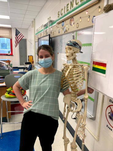 Toon and Bones: Baleigh Toon poses with a model skeleton in her temporary classroom. Photo courtesy: Owen McCabe, September 23, 2021.