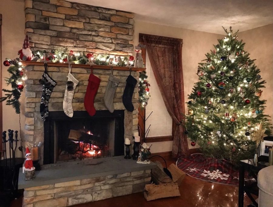 Cozy Fireplace: Christmas decorations on the fireplace and tree help spread the holiday spirit.