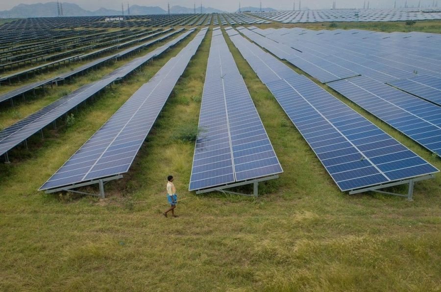 The World Best Choice: Football fields with long solar panels cover the countryside in India as the country increases their net green energy, Photo Courtesy: Abhishek Chinnappa, October 14, 2021.
