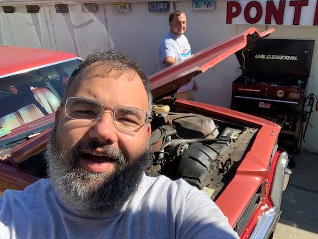 Frank Tupka and his friend Bobby working on a 1976 Pontiac LeMans. Photo Courtesy: Frank Tupka, September 7, 2021.