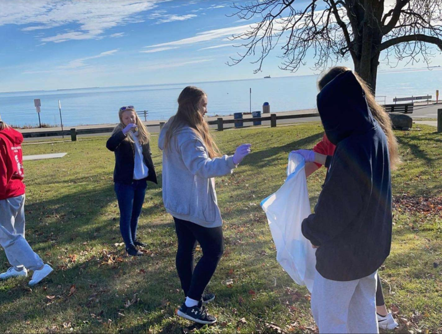 Sound Lions in Action: Sound Lions members help clean the environment at their last beach clean up, at Woodmont Beach. Photo Courtesy: Jamie D’Avignon, December 5, 2021 