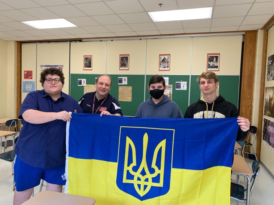 Holding+Up+The+Banner%3A+Mr.+Cesare%E2%80%99s+AP+US+History+students+hold+up+the+Ukrainian+Flag.