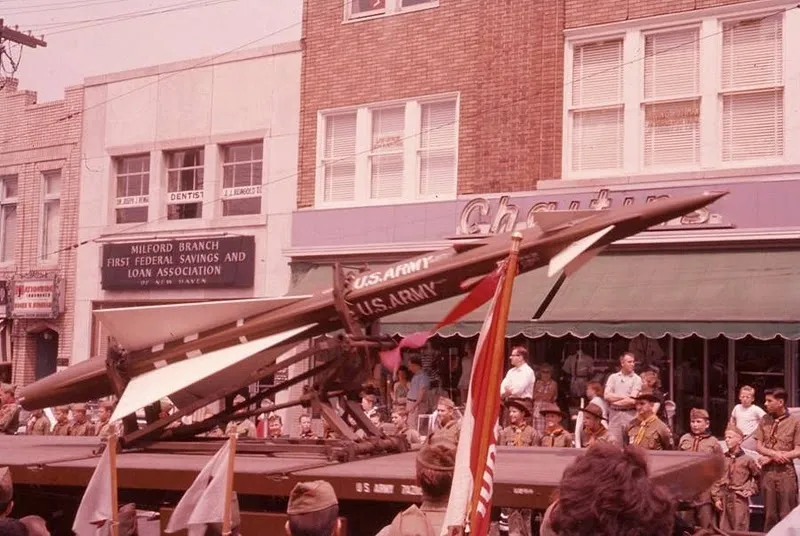 A Nike Ajak missile being paraded through downtown Milford . Photo courtesy: https://coldwar-ct.com/ , “Probably early sixties.”  