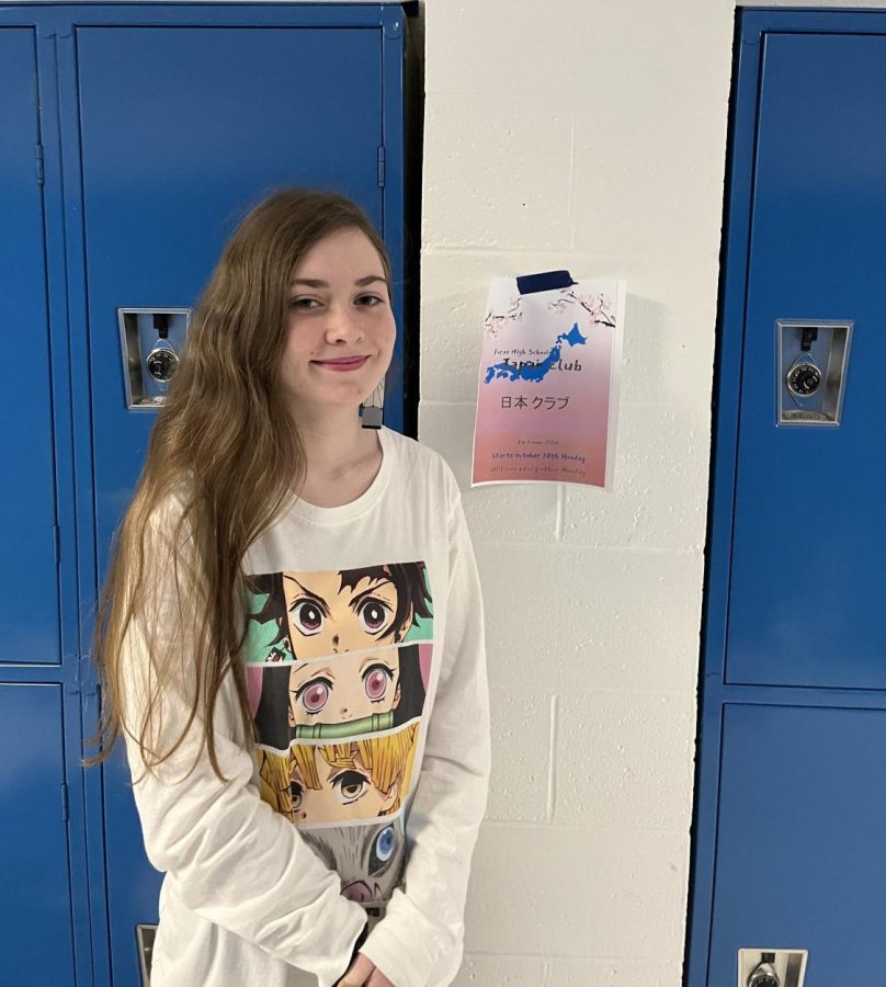 Co President of Japan Club: Nicole Hale poses in front of Japan poster in hallway, October 17, 2021.