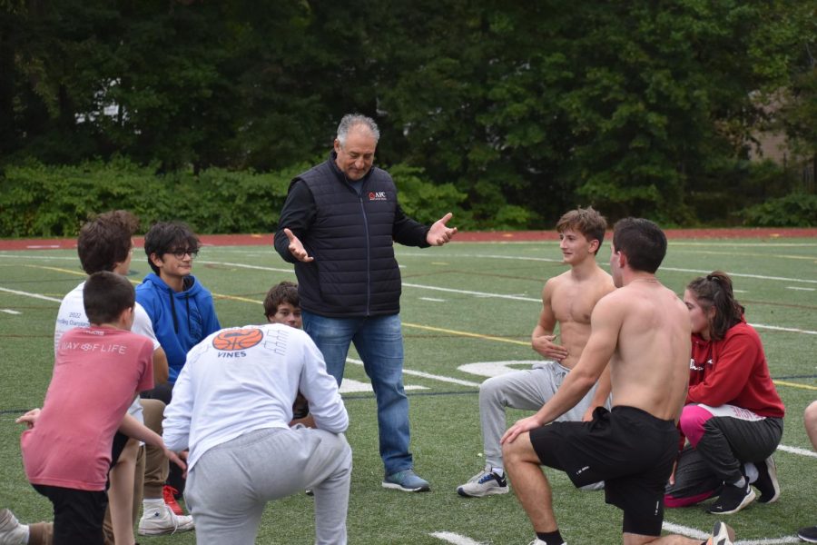 Group Huddle: Coach Esposito having end of conditioning talk with all of the wrestlers, October 3, 2022. 