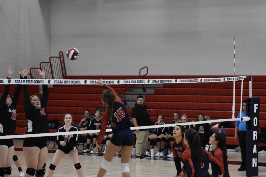 Foran Girls Volleyball: Senior Volleyball player Katylin Beaupre spiking the ball over the net. October 8, 2022.