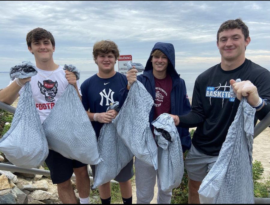 Battling Environmental Troubles In Science Olympiad: From left to right: team members Ethan Domingue, Evan Kerzner, Jack Pietrosanti, Joe Gaetano smile for a picture after they collected trash, September 11, 2022.