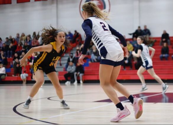 Doyle Dribbling Up the Court: Doyle takes the ball up, while being guarded against Jonathan Law players, December 23, 2022. 