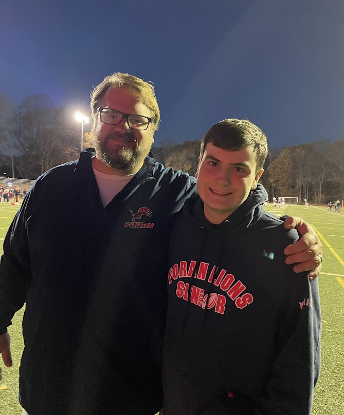 Manager Marchesseault on senior night: Gavin Marchesseault taking a picture with Coach Drew on football senior night, November 10, 2022. 