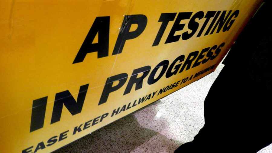 A+sign+is+displayed+outside+of+a+classroom+during+an+AP+exam.