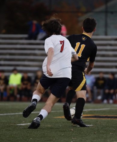 Heads up: Hackett (No. 7) and an opponent go for a ball in a Foran versus Law soccer game, November 13, 2022.