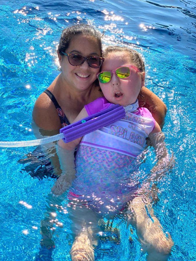 Sunny Day: Eva and her mother enjoying a day in the pool. March 13, 2023.