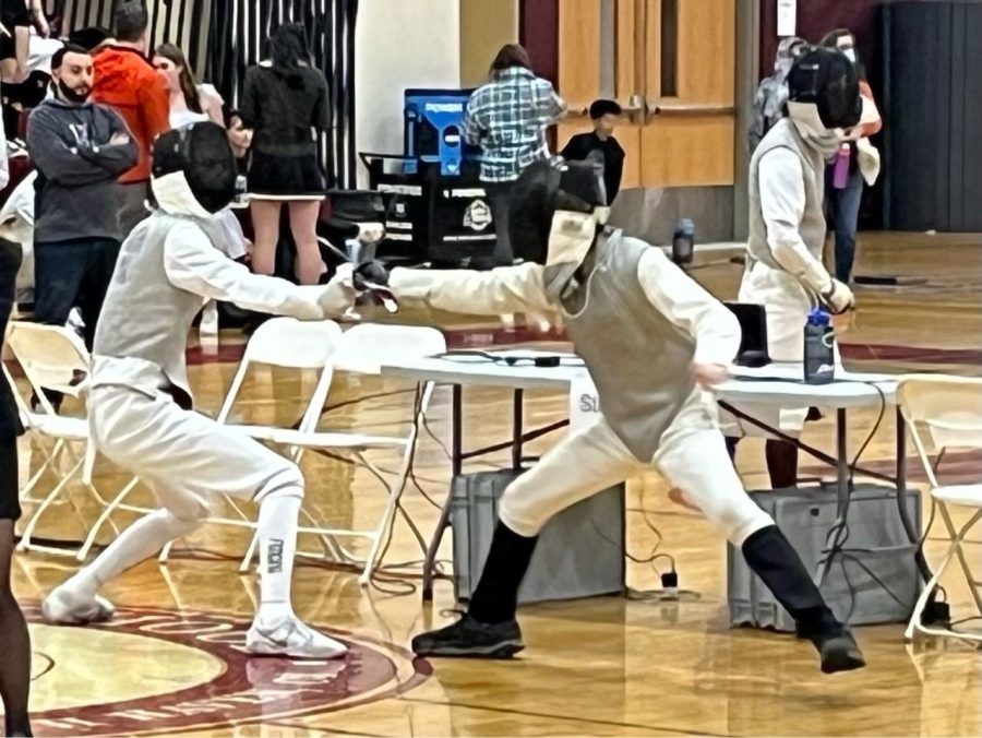 Fencing team in action: Foran fencer, Aidan Riha, strikes against opponent at Connecticut High School Junior Varsity tournament, January 15, 2023.