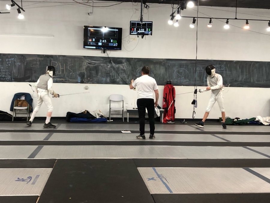 En gardé, Prêt, Allez!: Foran Fencer, Aidan Riha, stands ready to fight his opponent at local tournament.