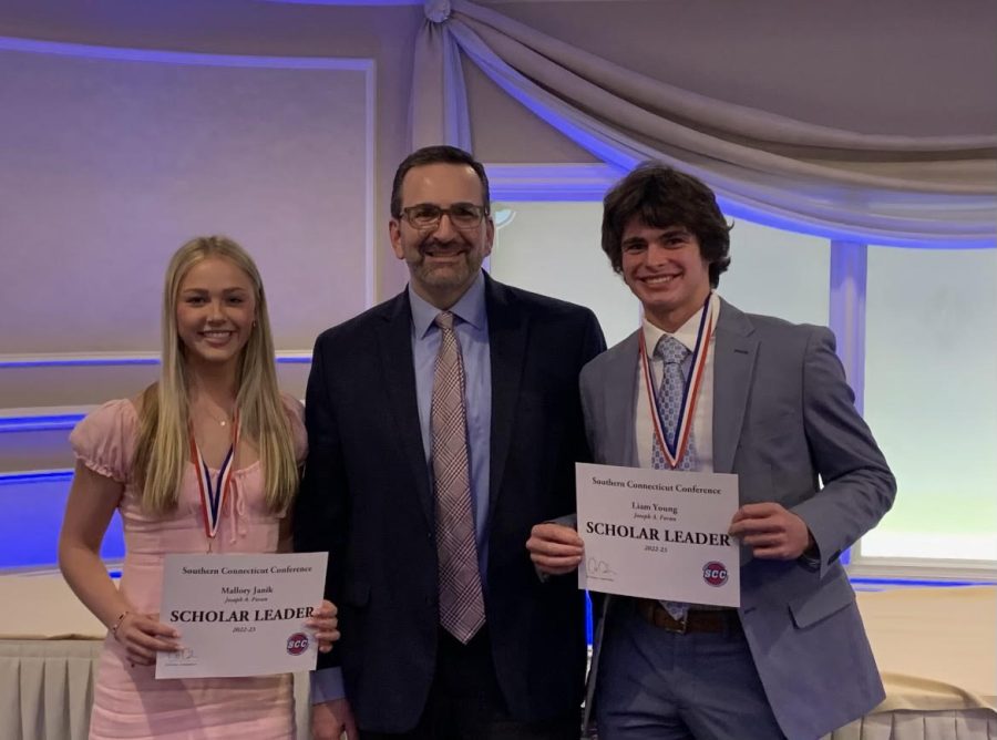  Banquet Dinner: Mallory and Liam pose for a photo with Mr. Berkowitz and their awards, March 27, 2023.