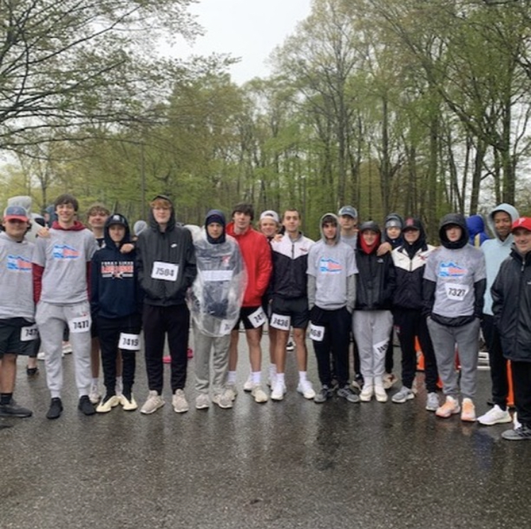 Ready, Set, Go: The boys lacrosse team poses for a picture just before starting the race. April 29, 2023. 