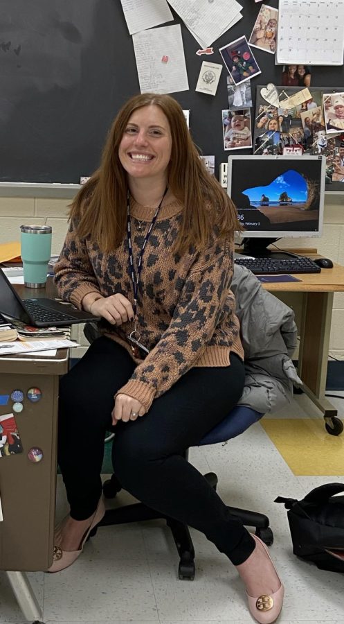 A True Foran Lion: English teacher Shauna Newall poses for a photo at her desk, December 8, 2022. 