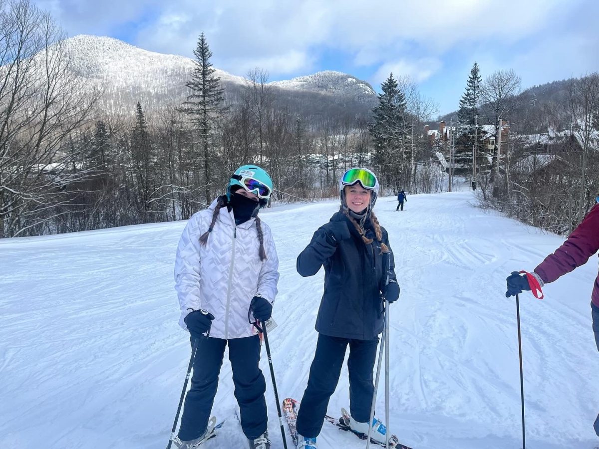 
Skiing into winter: Alana Finlayson and Aggie Dalton smiling for camera while skiing, February 5, 2022.