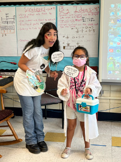 Helping Out: Foran alumni Bianca Torres poses with a student during her internship at Orange Avenue Elementary School, June 2022. 