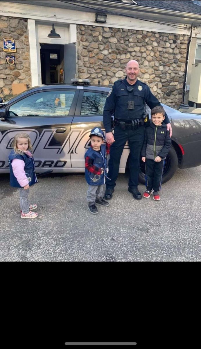 Spreading kindness: Officer Michael Dyki inspiring the next generation at the police station. 