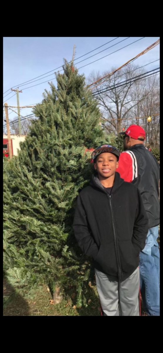 Chop+the+Wood%3A+Jaden+Prosser+cutting+down+a+tree+for+Christmas+with+his+family.%0A