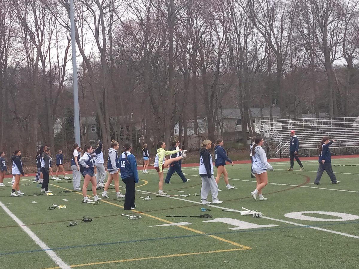 Road+To+Gold%3A+The+girl%E2%80%99s+lacrosse+team+warms+up+ahead+of+practice.+March+27%2C+2024.