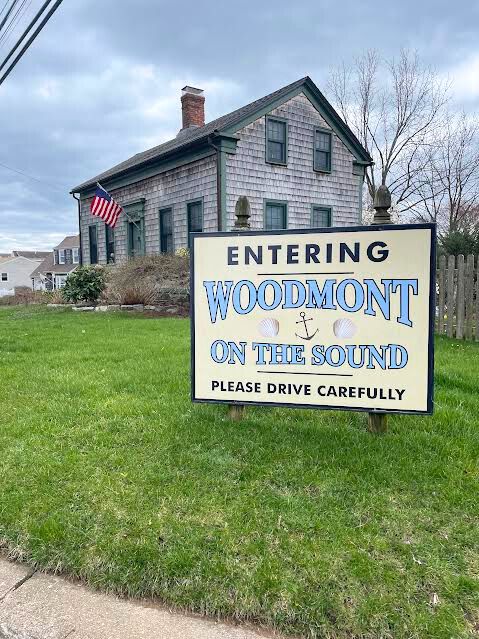 Entering Woodmont 
The “Entering Woodmont On The Sound” sign welcomes residents and other local citizens. Located behind the sign, stands the Bryan House, an artifact dated back to 1790. Woodmont, CT, 2024.
