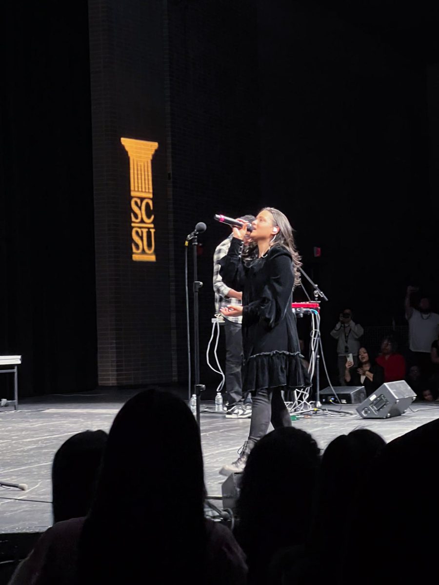 Taken on April 6, 2024 at 10:06pm at the Lyman Center. As the crowd cheers louder, Morillo is introducing her last song of the night, “Mesias”.