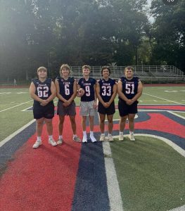 Football fun: Pictured are captains Joey Gagliardi, Jagger Rees, Zach Queiroz, Wyatt Shallis, and Brandon Marschner in uniform. 