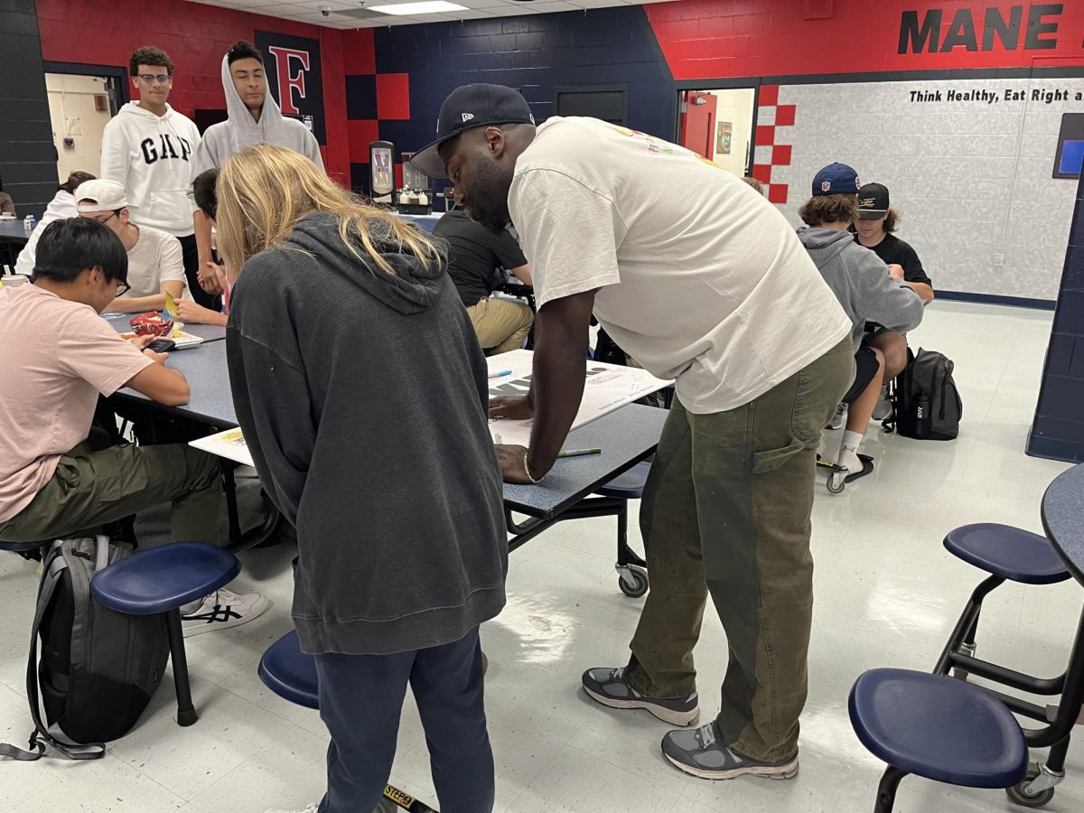 Working with Words of Affirmation: Students participating in an activity where they receive a random prompt relating to words of affirmation. September 23, 2024. Photo by Laney Chan