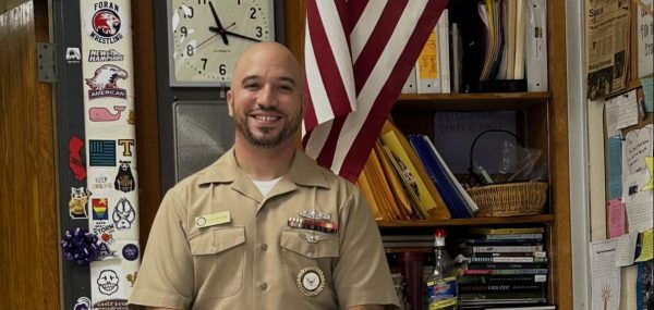 Standing strong and brave: Petty Officer David Hill-DeStefano standing next to the American Flag. November 8, 2024. Photo courtesy: Jack Kepshire
