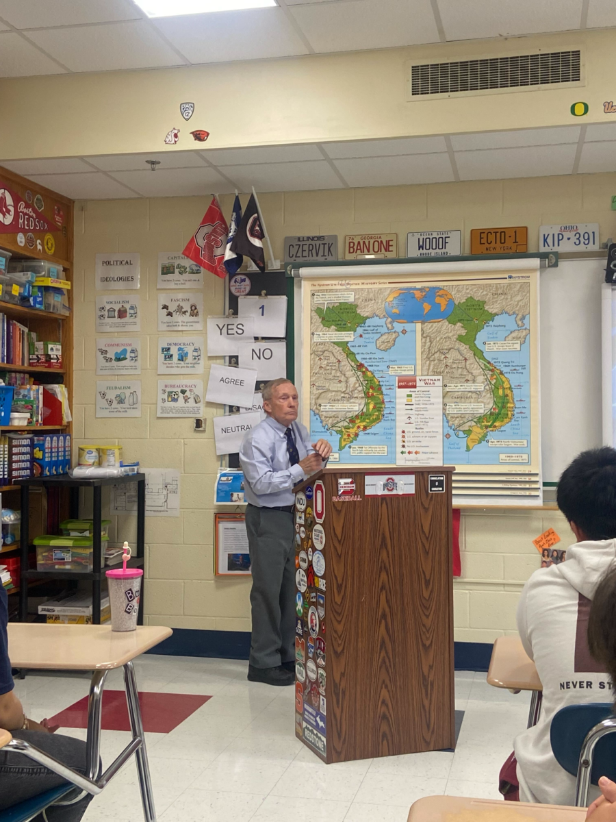 
Telling his Story: Veteran John Nelson stands in a Foran classroom after presenting to students, November 8, 2024. Photo courtesy: Jagger Rees.