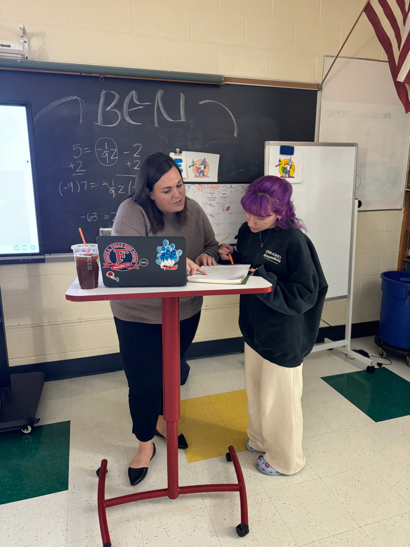 Helping:: Pullins helping one of her students, October 21, 2024. Photo Courtesy: Averi Ferris.