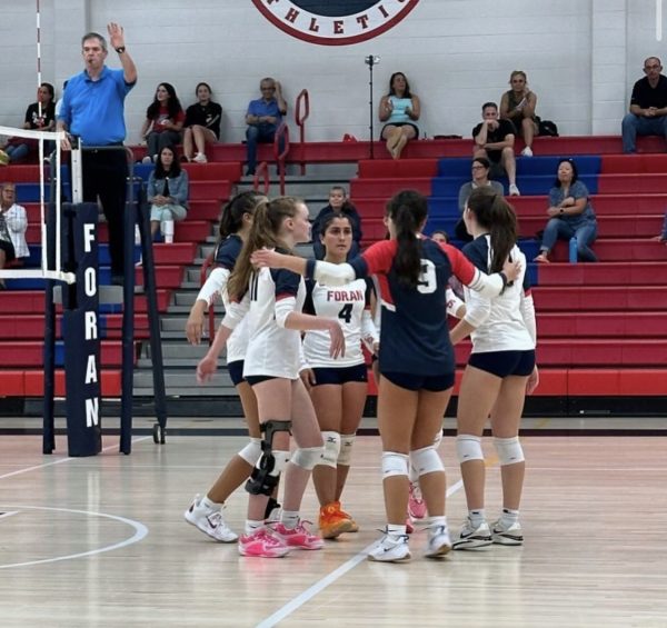 Varsity volleyball game: The girls huddling up while playing a game. (taken November 4th, 2024) Photo Courtesy: Jeffrey Raucci