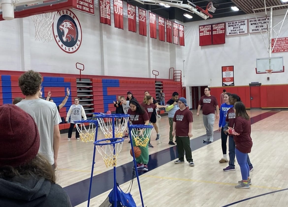 Athletes in Action: Unified Sports Team and Peer Coaches playing basketball. February 14, 2024. Photo courtesy: Justin Zywocinski. 